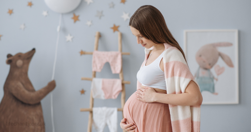pregnant woman in nursery
