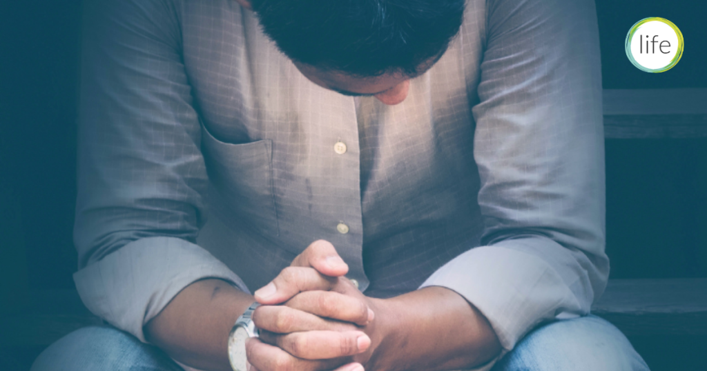 Young man grieving abortion