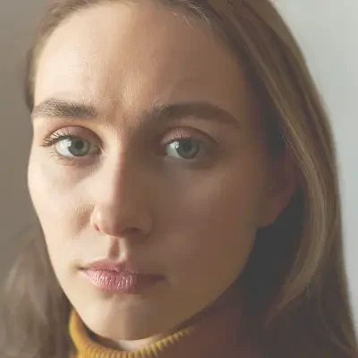 Young woman with a serious expression looking at camera